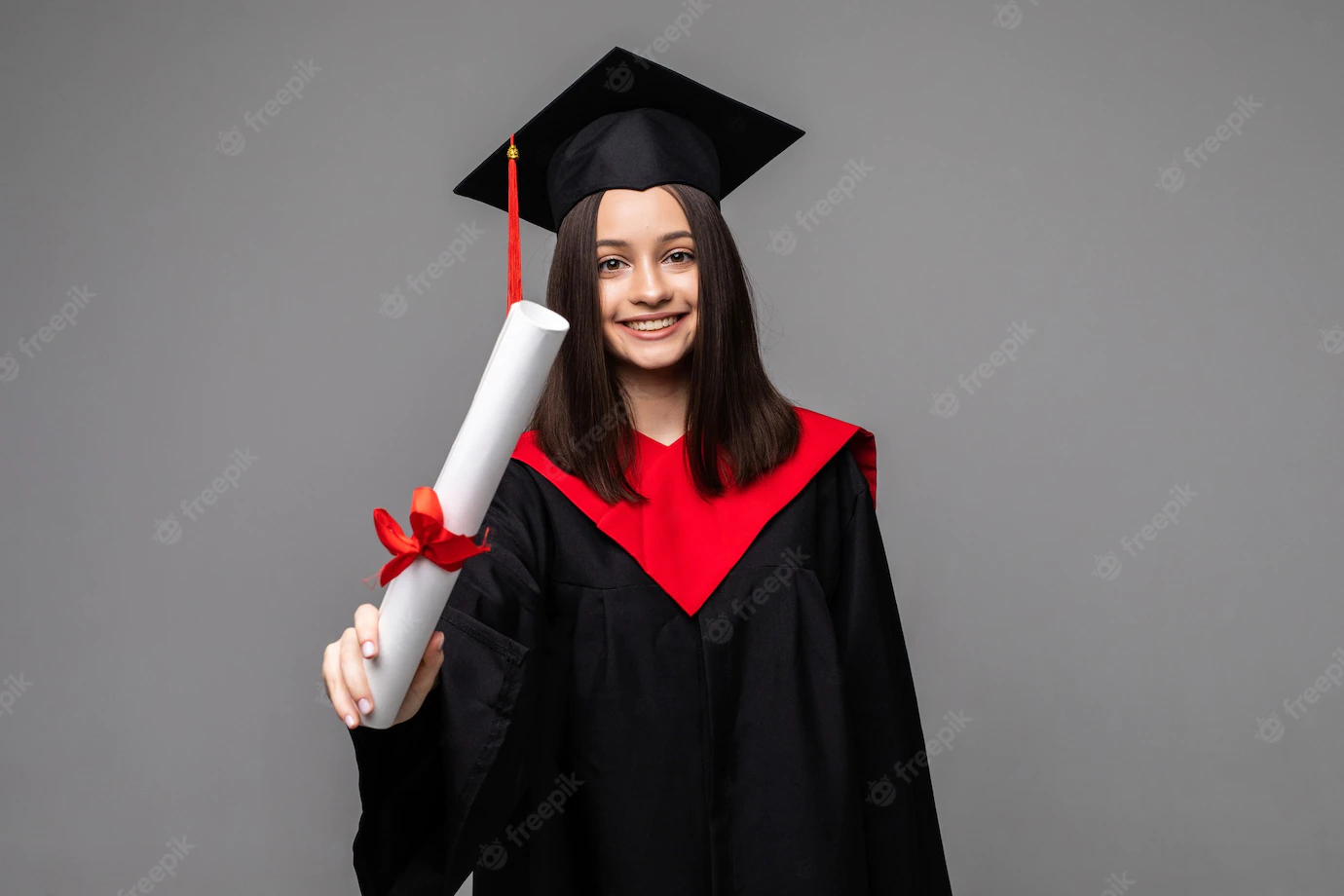 happy-student-with-graduation-hat-diploma-grey_231208-12981